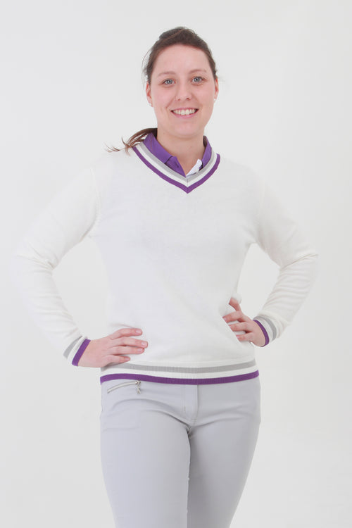 This ladies golf jumper is perfect for those early morning rounds.  Paired with the ladies golf polos from the JRB Ladies Golf collection and you will be on winning form. Ladies love golf and ladies love golf clothes.  This white golf sweater has a purple trim - so stunning to wear whilst playing your Daily Sport.
