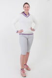 This ladies golf jumper is perfect for those early morning rounds.  Paired with the ladies golf polos from the JRB Ladies Golf collection and you will be on winning form. Ladies love golf and ladies love golf clothes.  This white golf sweater has a purple trim - so stunning to wear whilst playing your Daily Sport.